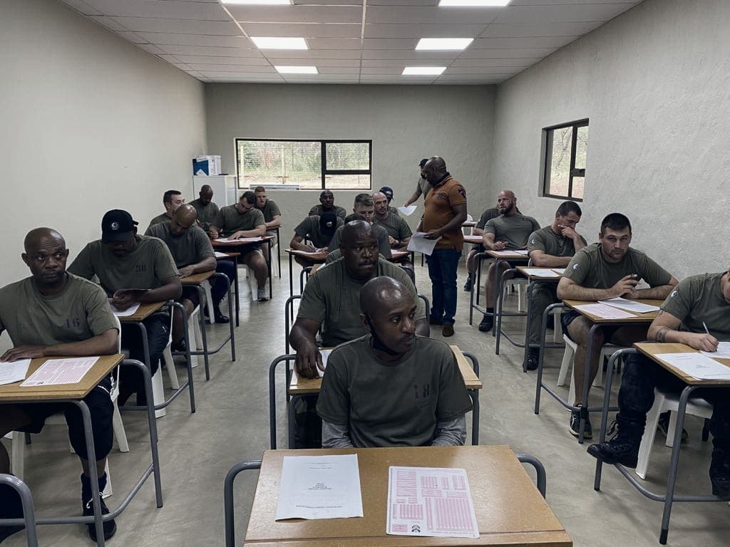 Candidates writing an assessment in a classroom