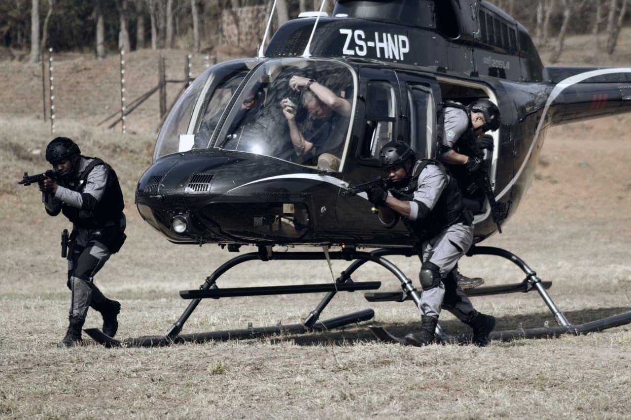 Tactical team exiting helicopter ZS-HNP